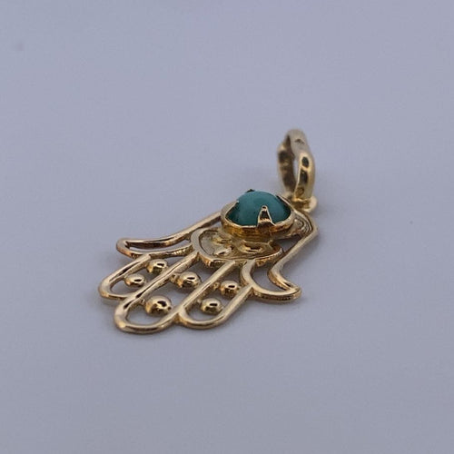 Pendentif Pendentif main de Fatma en or jaune 18 carats et turquoise 58 Facettes 250186