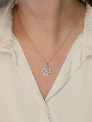 Collier Poiray - Collier cœur entrelacé en or blanc 18K et diamants 58 Facettes 1091.1