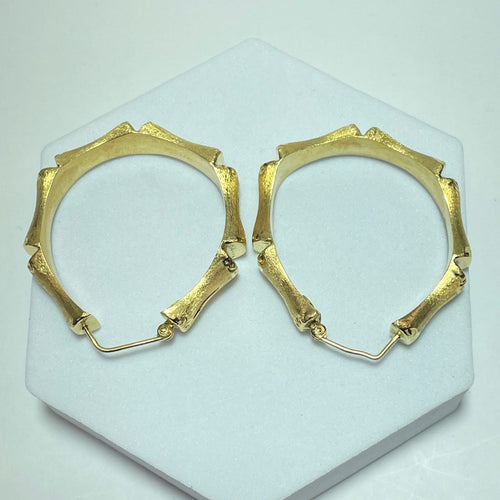 Boucles d'oreilles Boucles d’oreilles créoles bambou en or jaune 18 carats 58 Facettes 250094