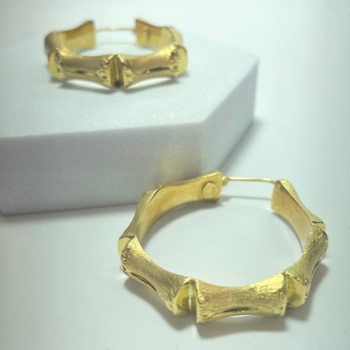 Boucles d'oreilles Boucles d’oreilles créoles bambou en or jaune 18 carats 58 Facettes 250094