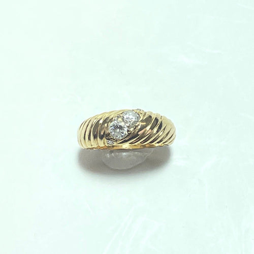 Bague 47 Bague torsadée en or jaune 18K et diamants 0,32 ct 58 Facettes 250336