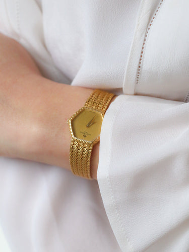 Montre Baume & Mercier - Montre vintage en or jaune 18 carats à maille tressée 58 Facettes 1067.3