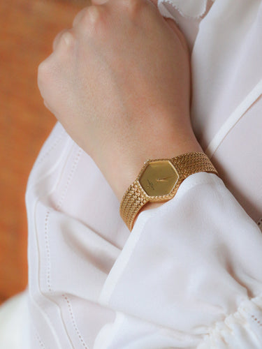 Montre Baume & Mercier - Montre vintage en or jaune 18 carats à maille tressée 58 Facettes 1067.3