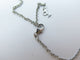 Collier Piaget Limelight - Collier chaîne Y avec pendentif cœur en or blanc et diamants 0,29 ct 58 Facettes 221585