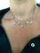 Collier Collier draperie en or gris et diamants 58 Facettes 1