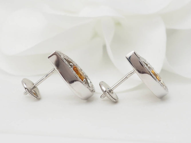 Boucles d'oreilles Boucles d'oreilles en or blanc 18 ct, citrines et diamants 58 Facettes 32804 b