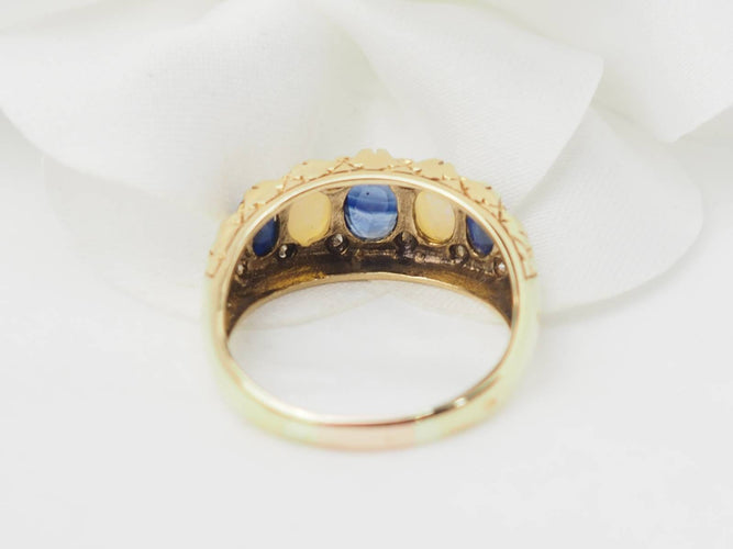 Bague 56.5 Bague jarretière en or jaune 18 kt, saphirs et pierres de lune 58 Facettes 33246