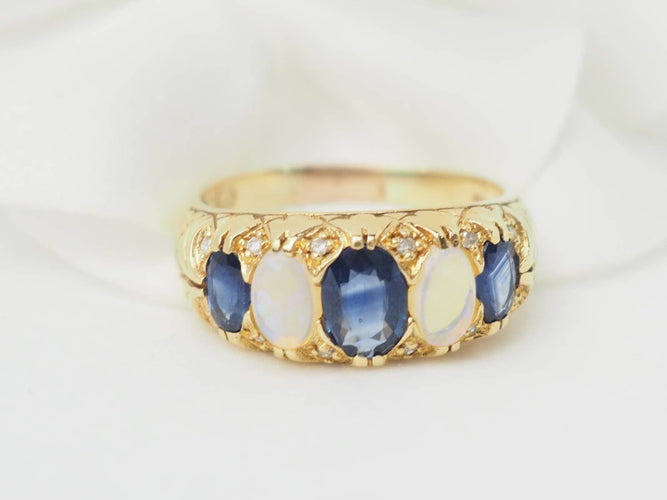 Bague 56.5 Bague jarretière en or jaune 18 kt, saphirs et pierres de lune 58 Facettes 33246