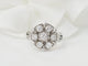 Bague 50 Bague marguerite en or blanc 18 kt et diamants 58 Facettes 33515