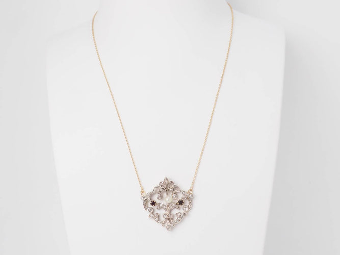 Collier Collier volutes en or jaune 18 ct, argent, diamants, grenats et perle 58 Facettes 33049