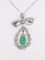 Collier Collier nœud Belle Époque en platine, émeraude et diamants 58 Facettes 1188.1