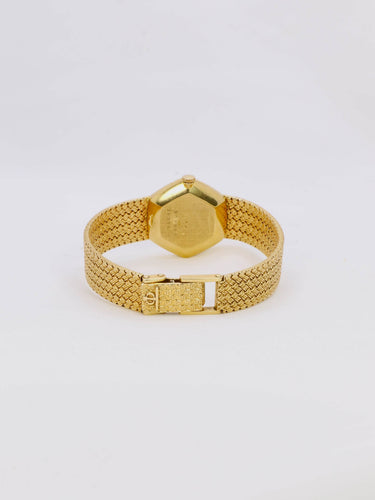 Montre Baume & Mercier - Montre vintage en or jaune 18 carats à maille tressée 58 Facettes 1067.3