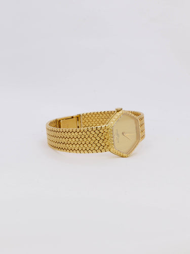 Montre Baume & Mercier - Montre vintage en or jaune 18 carats à maille tressée 58 Facettes 1067.3