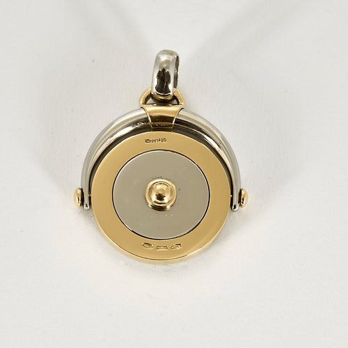 BULGARI - TONDO Zodiaque - Pendentif en or jaune et acier.