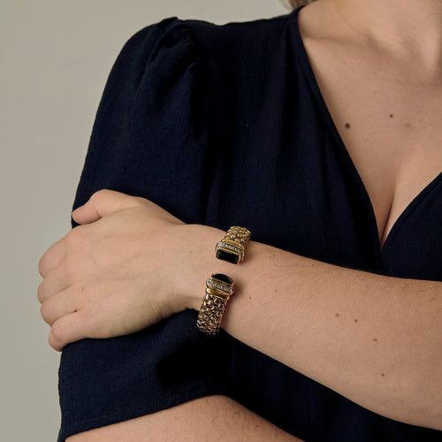 Bracelet semi rigide en or jaune, onyx et diamants