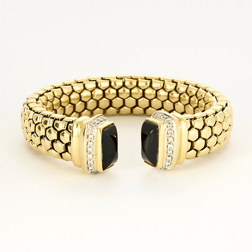 Bracelet semi rigide en or jaune, onyx et diamants