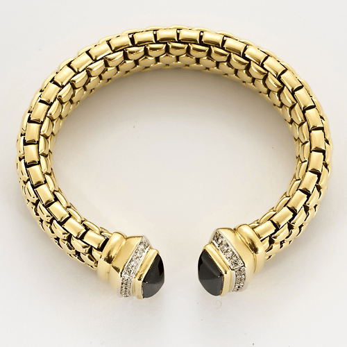 Bracelet semi rigide en or jaune, onyx et diamants