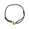DINH VAN - Serrure - Bracelet Menotte R8 en or jaune. Cordon noir.