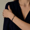 DINH VAN - Serrure - Bracelet Menotte R8 en or jaune. Cordon noir.