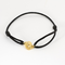 DINH VAN - Serrure - Bracelet Menotte R8 en or jaune. Cordon noir.