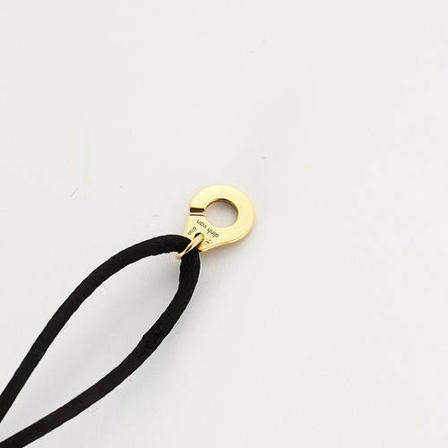 DINH VAN - Serrure - Bracelet Menotte R8 en or jaune. Cordon noir.