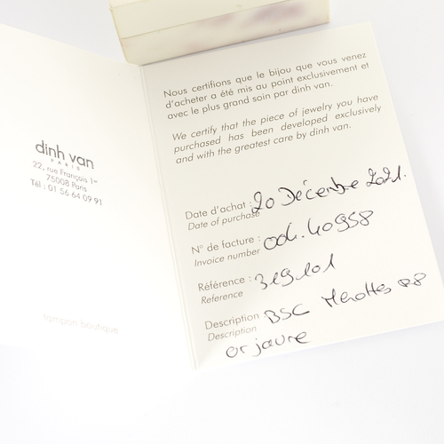 DINH VAN - Serrure - Bracelet Menotte R8 en or jaune. Cordon noir.