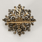 Broche Broche Fleur en or, argent et diamants 58 Facettes DV23466-2