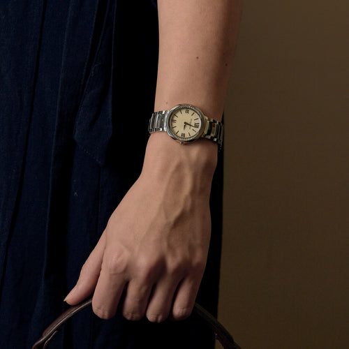 Baume et Mercier - Montre de dame en acier et diamants