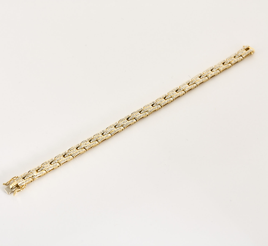 Bracelet en or jaune articulé et diamants