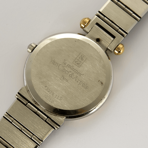 VAN CLEEF & ARPELS - Montre en acier et acier plaqué or à boitier rond et mouvement quartz