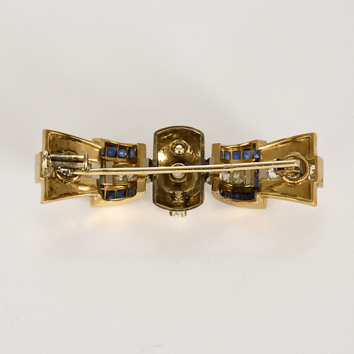 Broche en or jaune, or gris à motif de noeud, saphir calibré et diamants 58 Facettes DV27468-21