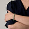 Attribué à STERN - Bracelet en or gris, émeraudes et diamants