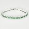 Attribué à STERN - Bracelet en or gris, émeraudes et diamants