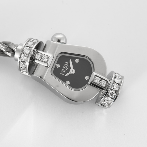 FRED - Montre de dame en acier à boitier en forme de manille et diamants