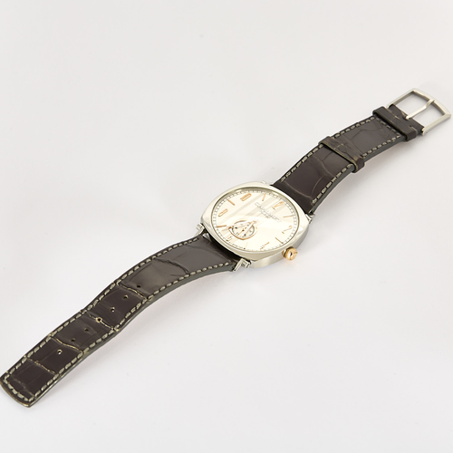 CHAUMET - DANDY - Montre en acier, acier doré à boitier tonneau et à mouvement mécanique