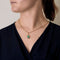 Pendentif en or jaune, opale à fond noir et petits diamants