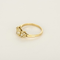 Bague type solitaire en or jaune, diamant natural fancy yellow 0.79 carat et petits diamants blancs