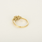 Bague type solitaire en or jaune, diamant natural fancy yellow 0.79 carat et petits diamants blancs