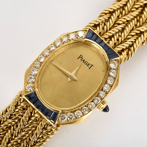 Montre PIAGET - Montre de dame en or jaune, saphir et diamants 58 Facettes DV22202-1