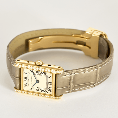 Cartier Montre Tank en or jaune et diamants 58 Facettes DV31731-1