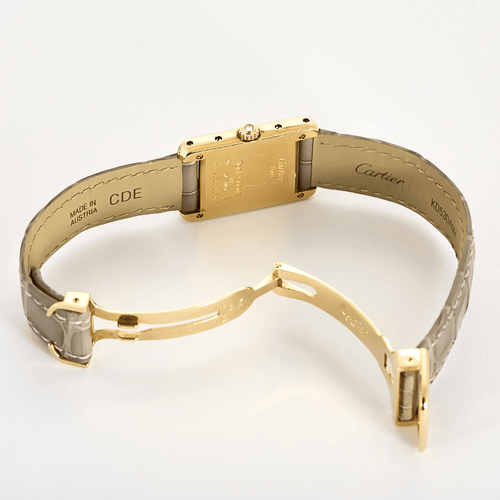 Cartier Montre Tank en or jaune et diamants 58 Facettes DV31731-1