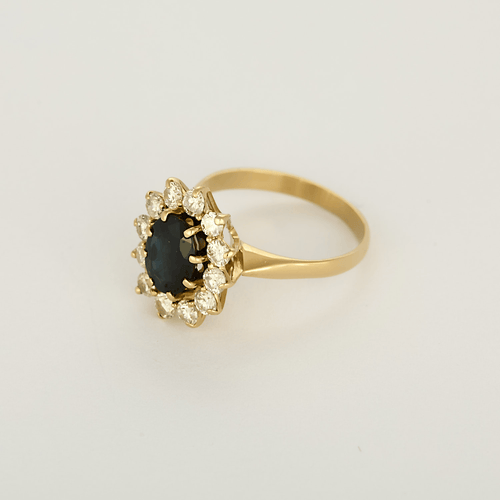 51 Bague marguerite en or jaune, diamants et saphir 58 Facettes DV34627-1