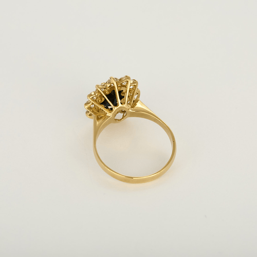 51 Bague marguerite en or jaune, diamants et saphir 58 Facettes DV34627-1