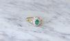 https://cdn.shopify.com/s/files/1/0075/4588/0666/products/bague-marguerite-emeraude-et-diamants-sur-or-124242.jpg?v=1685598211