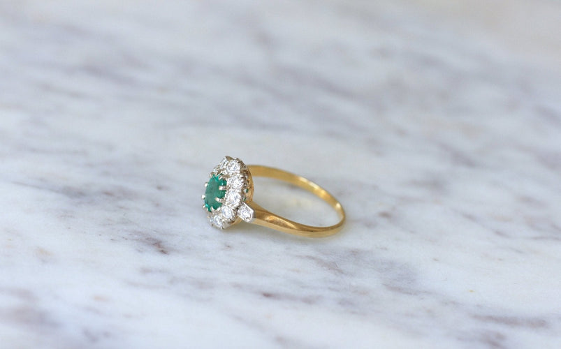 https://cdn.shopify.com/s/files/1/0075/4588/0666/products/bague-marguerite-emeraude-et-diamants-sur-or-725151.jpg?v=1685598211