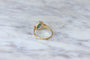 https://cdn.shopify.com/s/files/1/0075/4588/0666/products/bague-marguerite-emeraude-et-diamants-sur-or-929718.jpg?v=1685598211
