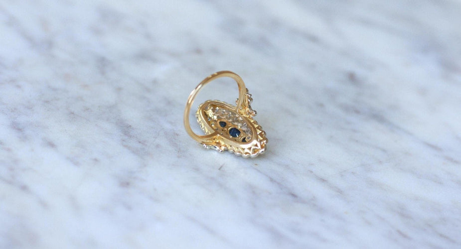 Bague 53 Bague marquise en or jaune et blanc 18kt et saphirs, diamants 58 Facettes