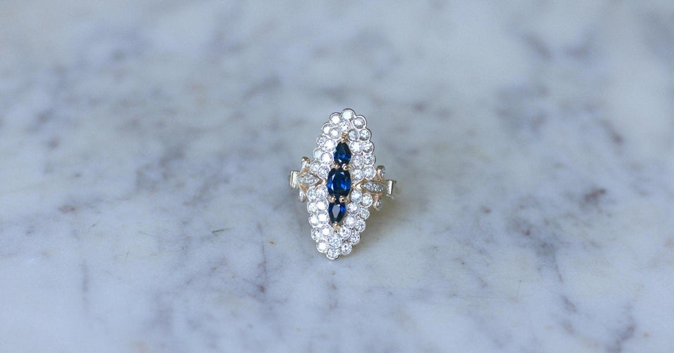 Bague 53 Bague marquise en or jaune et blanc 18kt et saphirs, diamants 58 Facettes