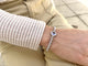 Bracelet Fred Pain de Sucre - Bracelet en or gris 18K, tanzanite et diamants 58 Facettes FB08115