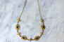 Collier Collier draperie en or jaune 18k et saphirs cabochons 58 Facettes